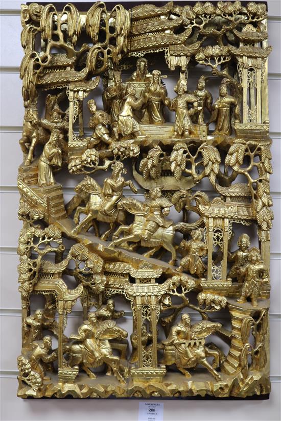 Six Chinese carved giltwood panels of soldiers amid pavilions